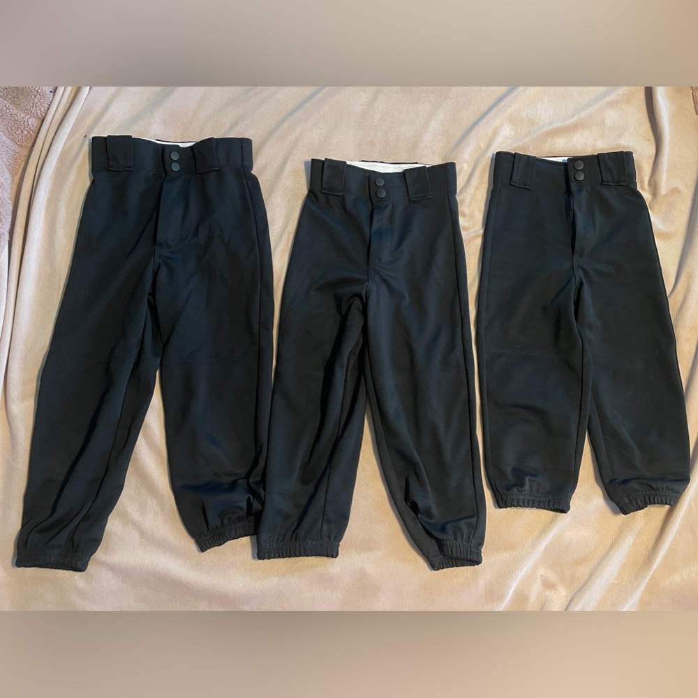 3 pair gently used black baseball/softball pants. Size S, XS and XXS.